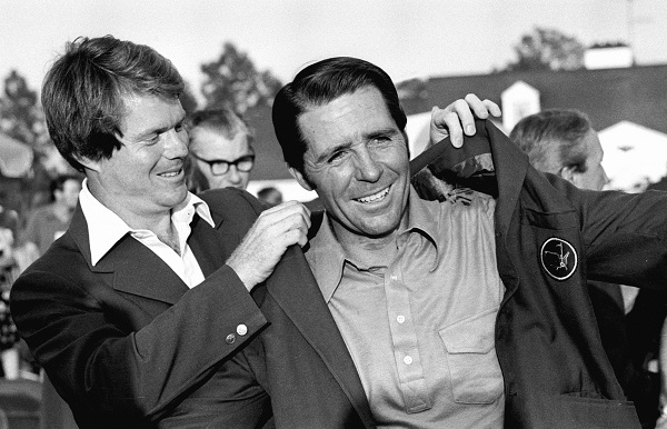 Tom Watson, 1977 Masters champion, places the green coat on Gary Player, right, winner of the Masters Golf Tournament at the Augusta National Golf Club in Augusta, Ga., April 9, 1978. Player is now a three-time Masters champion. (AP Photo)