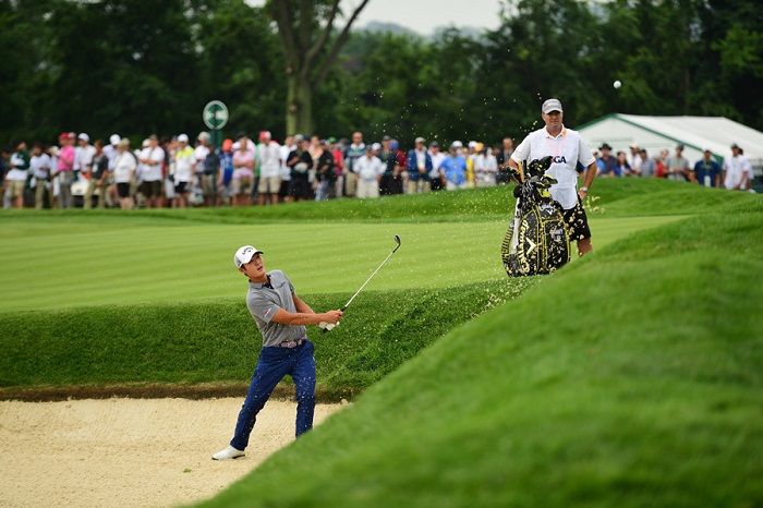 Danny Lee escapes a deep greenside bunker on Thursday (Source: Golf.com)