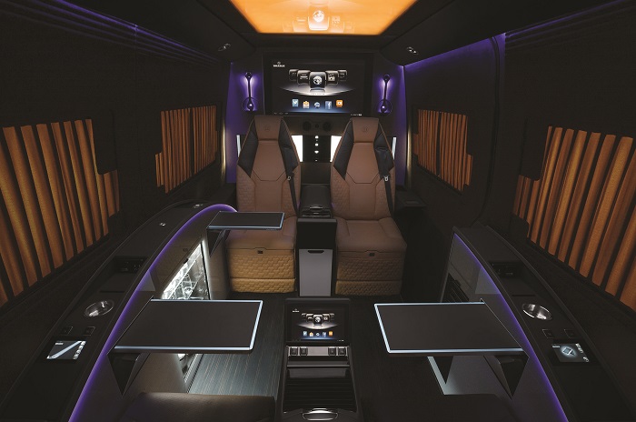 Brabus-Mercedes-Benz-Sprinter-Business-Lounge-seats-with-tables-night