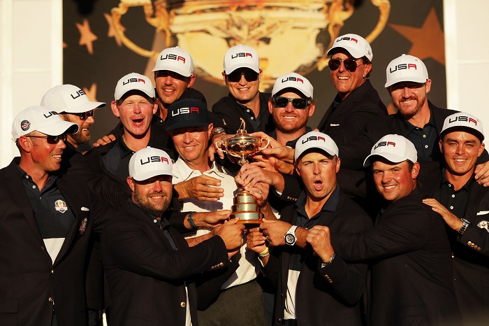 CHASKA, MN - OCTOBER 02: Matt Kuchar, Dustin Johnson, Brandt Snedeker, Ryan Moore, Davis Love III, Brooks Koepka, Zach Johnson, J.B. Holmes, Jordan Spieth, Phil Mickelson, Jimmy Walker and Rickie Fowler of the United States celebrate during the closing ceremony of the 2016 Ryder Cup at Hazeltine National Golf Club on October 2, 2016 in Chaska, Minnesota. (Photo by Streeter Lecka/Getty Images)