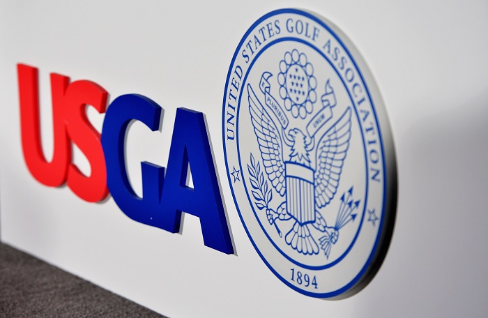 ARDMORE, PA - JUNE 10: A USGA logo is seen in the interview room during a practice round prior to the start of the 113th U.S. Open at at Merion Golf Club on June 10, 2013 in Ardmore, Pennsylvania. (Photo by Drew Hallowell/Getty Images)