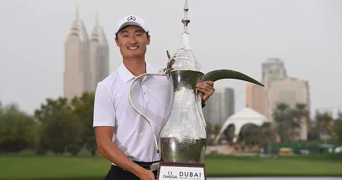 Haotong Li of China celebrates victory after the final round of the Omega Dubai Desert Classic