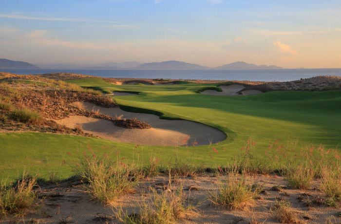 The 18th hole at KN Golf Links Cam Ranh offers stunning views of the ocean