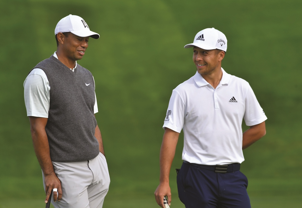 Xander Schauffele with Tiger Woods